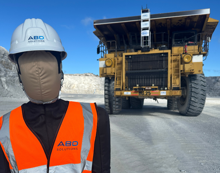 Dummy in front of mining truck